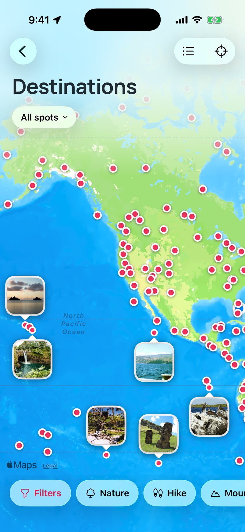 The map pulled back to the whole world, a spread of pins